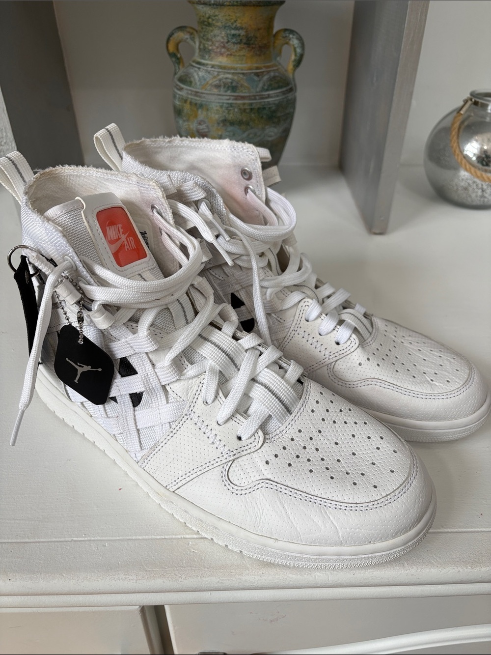 Nike White High-Top Sneakers with Coral Logo Accent